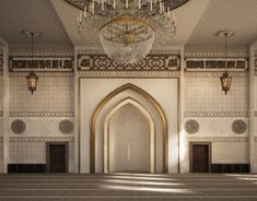 an empty room with chandelier and stairs leading to the exitway in front of it