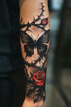 a person with a tattoo on their arm holding a rose and butterfly in the middle