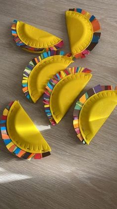 paper plate crafts are arranged on the floor