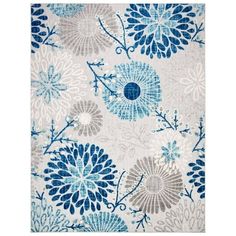 a blue and white rug with flowers on it