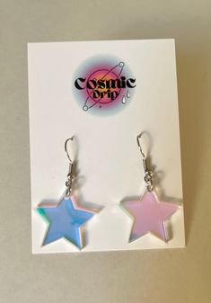 Crafted with iridescent acrylic, these earrings shine and reflect prisms of light, giving off a magical celestial vibe! Handmade with lightweight materials, the Star Girl earrings are comfortable to wear all day long. - Made with iridescent acrylic- Color appearance changes depending on how light is hitting them- Earring hooks are stainless steel, nickel-free, and hypoallergenic- Rubber backing included to keep them secure Rave Jewelry, Space Earrings, Iridescent Acrylic, Star Earring, Celestial Earrings, Tiny Star, Rainbow Earrings, Earring Crafts, Prisms