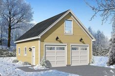 a two car garage with snow on the ground and trees in the background, is shown