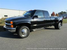 a black pickup truck parked in a parking lot