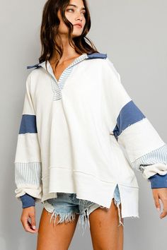 This French terry knit top is a great addition for your wardrobe, especially for those who are seeking comfort and style. It features a big collar, Henley style, and long dolman sleeves. The ivory and blue color block adds a pop of color, giving off the perfect laidback vibes. Pair it with distressed shorts or blue jeans for a casual, yet refined look. Features: Raw edge details, French terry knit, big collar, Henley style, long dolman sleeves, contrast color block details Fit: Oversized, loose Big Collar, Loose Fitting Tops, Pullover Designs, Block Design, Christmas Wishlist, Raw Edge, Tunic Top, Christmas List, Leotards