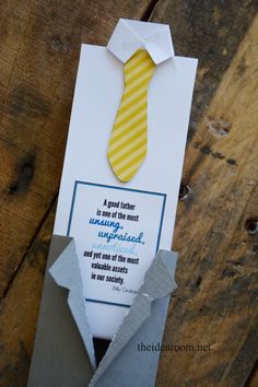 an origami tie is on top of a card that says, a good father is one of the most unplanned