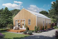 a small wooden house sitting on top of a lush green field