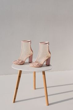 The cutest bridal boots you have ever laid your eye on.  'MARRY' boots are handcrafted in pink suede with handmade embroidery - a delicate mix of pearls and beads. They have a zipper on the back for easy fitting. The heel measures 8 cm / 3.1 inches tall and cushioned insoles ensure comfort for all-day wear. This shoe is handmade using the best quality Italian upper suede, hand embroidery of pearls and beads, genuine leather lining.  Inside there is a soft Memory foam insole, which gives a feeling of additional comfort when walking. Tunit outsole is made of a mixture of leather chips and rubber, it's more wear-resistant than leather and more durable. This type of outsoles is great for countries with rainy climates. Also, we use soft natural upper materials that wear well and take the shape Fitted Pink Wedding Shoes With Round Toe, Fitted Pink Wedding Shoes For Spring, Elegant Spring Wedding Boots, Pink Low Heel Party Boots, Pink Low Heel Boots For Party, Spring Wedding Boots With Pointed Toe, Embroidered Closed Toe Party Boots, Embellished Pink Boots For Evening, Embellished Pink Evening Boots