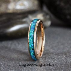 a ring with blue and green glitter in it