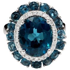 8.45 Carats Natural Impressive London Blue Topaz and Diamond 14K White Gold Ring Total Natural London Blue Topaz Weight: Approx. 8.00 Carats Center Topaz Weight is Approx. 7.00 Carats Center London Blue Topaz Measures: Approx. 12.00 x 10.00mm Natural Round Diamonds Weight: Approx. 0.45 Carats (color G-H / Clarity SI1-SI2) Ring size: 7 (we offer free re-sizing upon request) Ring total weight: Approx. 6.7 grams Disclaimer: all weights, measurements and colors are approximate and may vary slightly Emerald Cut Aquamarine Ring, Emerald Cut Rings, Gold Cocktail Ring, Blue Sparkles, Pink Topaz, 14k White Gold Ring, White Gold Ring, London Blue Topaz, Blue Gemstones