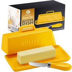 the butter dish is yellow and has a knife in it's box next to it