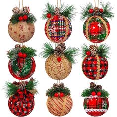 christmas ornaments hanging from strings and decorated with pine cones, fir needles and red berries