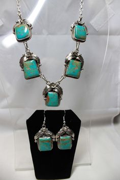 "Navajo Kingman Turquoise and Sterling Silver Necklace and Earring Set features gorgeous Kingman Turquoise Stones surrounded by Leaf and Flower Silverwork Each component measures approximately 3/4\" Square for both the necklace and earrings" Square Stone Pendant, Antique Turquoise Jewelry, Navajo Turquoise Jewelry, Silver Squash Blossom Necklace, Turquoise Jewelry Native American, Southwest Jewelry, Turquoise Stones, Feather Necklaces, Kingman Turquoise