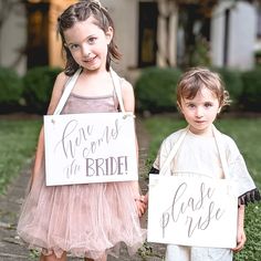 It's that moment... you are about to walk down the aisle. Right before you come out, send your flower girl and ring bearer (or the two cutest kids you can find) down the aisle with this set of banners to let everyone know to rise, because here comes the bride! Make a charming statement with our set of 2 flower girl signs for your wedding ceremony. Featuring the phrases 'Here Comes the Bride' and 'Please Rise,' these signs add a touch of whimsy and tradition to your special day. FEATURES & BENEFI Wedding Signs For Kids To Carry, Mayun Decor, Here Comes The Bride Sign, Wedding Entry, Ceremony Signage, Ring Bearer Signs, Flower Girl Signs, Ring Bearer Flower Girl, Bride Sign