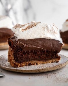 a slice of chocolate cake with whipped cream on top