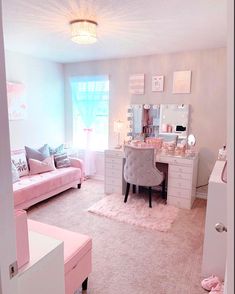 a bedroom with pink furniture and accessories in the room, including a bed, desk, chair, dresser and mirror