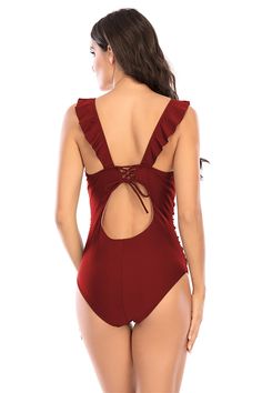 This feminine one piece swimsuit is trimmed with ruffles. The deep plunging v-neck is a super flattering neckline. The torso features ruching and tummy control, making this an ideal one piece for many body types. The back has a tie with a keyhole cutout detail below it. Tummy control ruching V-neck with ruffles Tie in back with keyhole cutout Polyester, Spandex NOTE: All swimwear is final sale, no returns are accepted How To Wear Kimono, Black Sequin Jumpsuit, Dresses Elegant Long, Sequin Jumpsuit, Party Dress Long Sleeve, Backless Mini Dress, Running Pants, Chiffon Long Sleeve, Faux Leather Pants