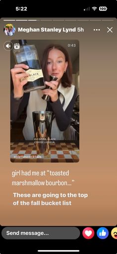 a woman holding up a bottle of wine in front of her face and the caption reads, she had me at toasted marshmallow bourbon these are going to the top of the