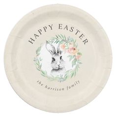 a paper plate with an image of a rabbit and flowers in the center that says happy easter