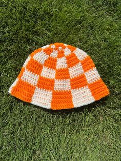 Elevate your style with our vibrant, Orange and White Crochet Checkered Bucket Hat! handcrafted with care and attention to detail, this unique accessory is perfect for adding a pop color in a touch of warmth to your outfits, making it ideal for game day excitement and beyond. Key Features: Eye-Catching Design: Our crocheted checkered pattern combines bold orange and crisp white to create a visually striking design that should turn heads.  Versatile Fashion: Whether you're heading to a game day, Orange Crochet Outfit, White Crochet Bucket Hat, Orange And White Crochet, Checkered Bucket Hat, Crochet Checkered, Crochet Orange, Pop Color, Crochet Bucket, Crochet Bucket Hat