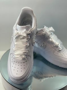 Custom made to order Wedding Bling Air Force 1s these shoes are customized with premium glass stones. I also offer the option of real crystals at an extra cost starting at $50-200 depending on what you want, I offer different varations of the shoe just ask me about them.  This is a Partial shoe( only parts of the shoe are done. Choose your size and color It takes 3-4 days to complete the shoe. My name is Tara my friends and family call me Tkool and that is where my business name comes from,I've been a bling artist since 2016 and I love love what I do so let TkoolzUniqueDezignz bling you out! Luxury White Custom Sneakers With Rhinestones, White Custom Sneakers With Rhinestones For Wedding, Custom Wedding Sneakers With Rhinestones, Wedding Custom Sneakers With Rhinestones And Round Toe, Luxury Custom Sneakers With Rhinestones And Round Toe, Real Crystals, Air Force 1s, Custom Bling, Bling Wedding