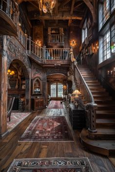 a large wooden staircase leading up to a second story with chandelier and windows