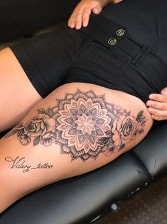 a woman with a tattoo on her thigh