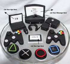 a cake decorated to look like video game controllers with instructions on the front and side