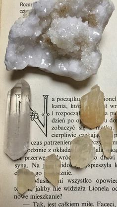 some rocks are sitting on top of an open book