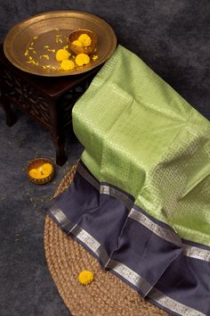 Experience true luxury and elegance with our authentic Ganga Jamuna Pure Zari Mulberry Silk Korvai Kanjivaram saree. Handcrafted with the finest quality silk, adorned with pure zari and featuring unique Korvai weaving, this saree is a timeless piece that exudes opulence and tradition. Elevate your wardrobe with this exquisite saree today. Banarasi Silk Saree With Zari Weaving, Banarasi Silk Saree With Zari Weaving And Temple Jewelry, Tussar Silk Saree With Zari Work And Temple Jewelry, Silk Mark Certified Chanderi Traditional Wear For Diwali, Chanderi Saree With Temple Jewelry For Diwali, Traditional Banarasi Silk Wear, Silk Mark Certified, Chanderi Dupatta For Puja, Silk Mark Certified, Silk Mark Certified Chanderi Dupatta For Puja, Chanderi Silk Mark Certified Dupatta For Puja