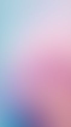 a blurry image of blue and pink colors