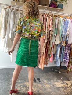 Dosa Green Silk Wrap Skirt. A fun and bright knee-length skirt in a grass green textured silk. Gives a modern-luau vibe! Interior is lined in a gorgeous patchwork stitched pattern, so the skirt could potentially be worn reversible as well! Wrap ties at the waist, allowing for an adjustable fit. Marked one size, but best fits a size M/L. 100% silk, dry clean only. Made in the USA. In excellent, like-new condition. Approx. Measurements: Adjustable waist: 15" through 18" laid flat across Length: 21 Green Knee-length Party Skirt, Green Knee-length Skirt For Party, Green Knee-length Mini Skirt For Summer, Green Flowy Mini Skirt, Spring Green Gathered Skirt, Spring Green Relaxed Skirt, Green Relaxed Mini Skirt For Summer, Green Pencil Mini Skirt For Party, Green Relaxed Skirt For Spring