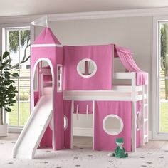 a child's bedroom with a pink castle bed and slide