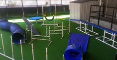 an indoor play area with blue and white equipment