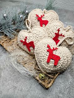 crocheted christmas decorations with red reindeers on them