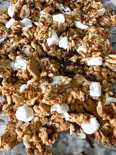 a pile of granola with marshmallows and chocolate