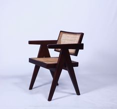 a wooden chair sitting on top of a white floor