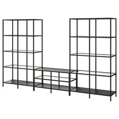 two black shelvings with shelves on each side