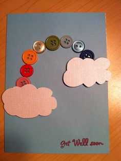 a card with buttons and clouds on it