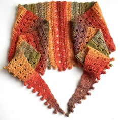 there is a crocheted scarf with fringes on it