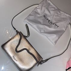 Metallic Silver Cross Body Bag With Zipper Enclosure And A Flap In The Front. In Like New Condition - Never Worn Before Comes With Dustbag Givenchy Crossbody Bag, Black Velvet Shoes, Pandora Bag, Crystal Purse, Givenchy Bags, Canvas Leather Tote, Red Chanel, Gucci Heels, White Crossbody Bag