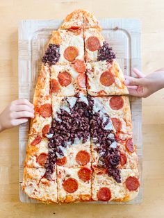 the pizza is cut into eight pieces and ready to be put in the oven for consumption