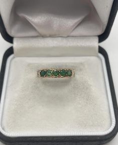 Looking for a unique band to add to your collection? You can't miss the gorgeous Victorian era detailing on the sides of this 9 carat gold ring with 5 beautiful natural emeralds.  Size 6.5, sizing options available for additional costs Emerald Band Ring, Born In May, Emerald Band, Unique Bands, Saint Paul, Natural Emerald, Emerald Ring, Victorian Era, Stacking Rings