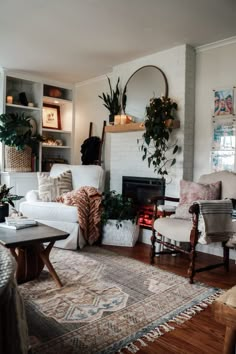 a living room filled with furniture and a fire place