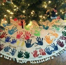 a christmas tree skirt with handprints on it