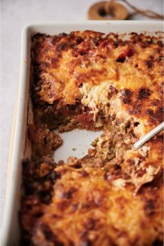 a casserole dish with meat and cheese in it, ready to be eaten