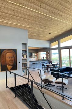 Photo of a modern upscale living room with slanted cedar ceilings with integrated warm white LED strip lights going across the ceiling. Cedar Ceiling, Light Highlights, Color Rendering