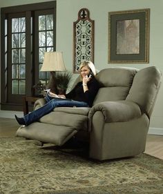 a woman sitting in a recliner talking on the phone