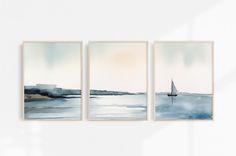 three watercolor paintings hanging on the wall