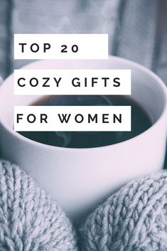 a woman's hands holding a cup of coffee with the words top 20 cozy gifts for women