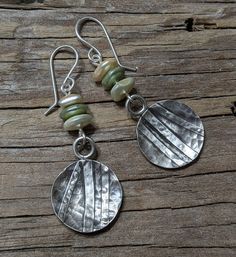 Handcrafted earrings made with Argentium Silver and imitation pearl beads. The hammered silver discs were oxidized with a patina to show off the textures. These earrings measure approximately 2 inches long by .75 inches wide. Saint Simons Island, Earrings Beaded, Argentium Silver, Handcrafted Earrings, Hammered Silver, Earrings Dangle, Pearl Beads, Handcrafted Jewelry, Beaded Earrings